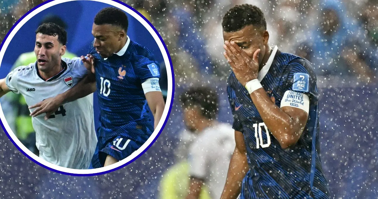 Kylian Mbappe w akcji podczas meczu Francja-Irak, na tle stadionu z widocznymi efektami burzy.